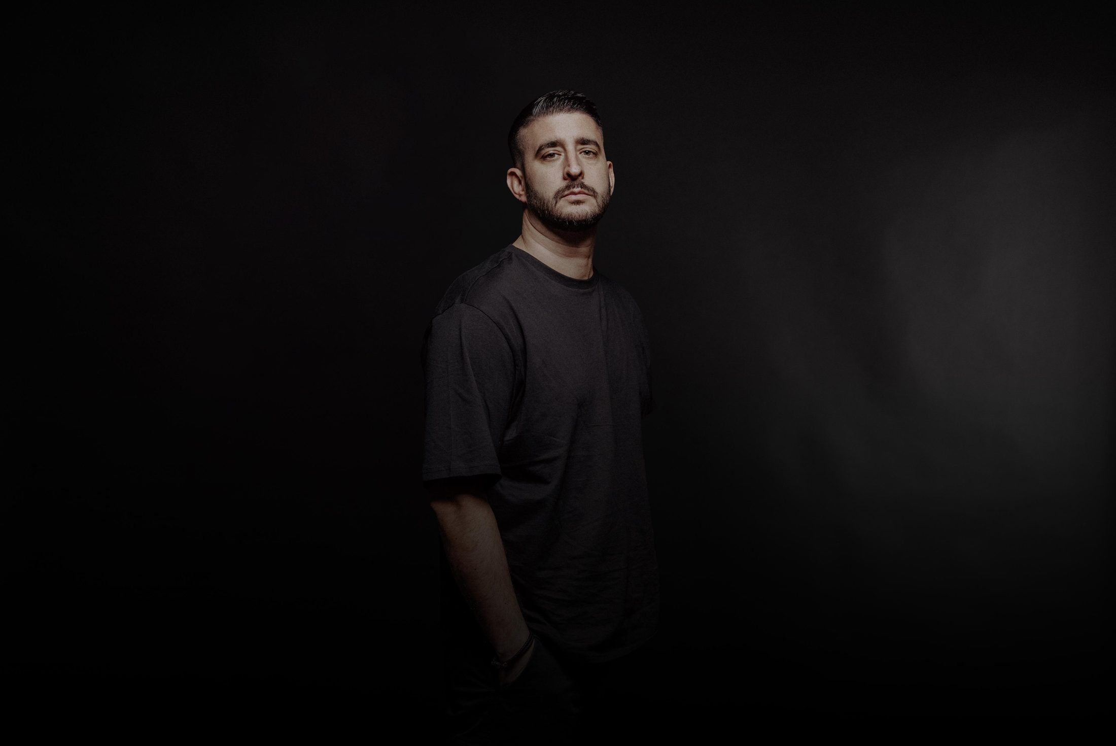Press portrait of Martin OCCO on a dark backdrop